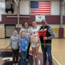 Surrounded by her family, Lila White celebrates the end of the girls basketball season. 