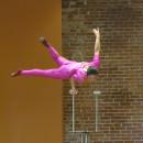 Part of Liu's act is a one-handed handstand. 