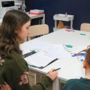 Penelope Angeley guides her student Olivia through a reading lesson. 