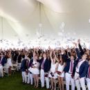 Graduates toss their commencement programs in the air at graduation on Friday, May 22. Photos source: Lawrence Films
