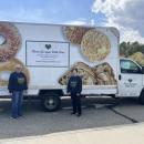 Maureen Vieira, left, and Nora DuPont stand beside the mobile food pantry at the Rochester Council on Aging. Photos by Grace Roche
