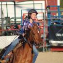 A rider rounds the barrels. Photos by Brandy Muz