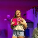 Sophie Sheridan, played by Fiona Roveda, sings during the opening scene of the show. 