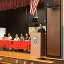 Theo Cooney speaks to his fellow Old Hammondtown graduates. 