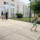 Kids run out of Sippican School after an early dismissal. 