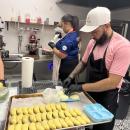 DeAndre Gibau pries chilled pastries from a mold. 