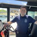Cameron Wentworth poses in the harbormaster's boat. Photo by Grace Roche