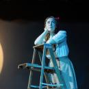 Emily gazes at the night sky after a conversation with George. 
