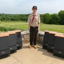 Eddie Brown poses with some of the bat houses he built. Photos source: Rochester Troop 31