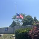 The Harbor Beach flag flies at half-mast in honor of James Rizza. Photo by Grace Roche