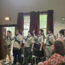 From left: Bryan Correia, Casey Cash, Cole Gretton, Iain McManus, Josh Van Inwegen and Eddie Brown recite the Eagle Charge during the court of honor July 18 at Rochester Grange Hall. Photo by Grace Roche