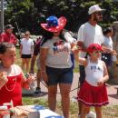 Attendees in patriotic garb ring bells at the Rochester event. 