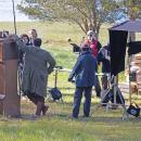 Crew members go over a scene on the bank of Slocums River.