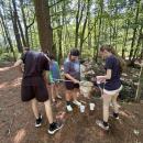 Program participants use nets and other tools to catch woodland animals. 
