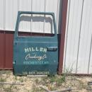 A car door from a now-closed cranberry farm sits on the property. 