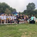 The Eitas family, surrounded by Madelyn's friends and soccer community, cut a ribbon to open Maddie's Circle at the Mariner Youth Soccer Complex on Friday, Aug. 28. Photos by Grace Roche