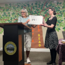 Library Director Kristen Cardoso accepts a plaque from the Rochester Historical Commission on Saturday, Aug. 22. Photo by Tanvi Kulkarni