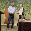 Senator Michael Rodrigues presents a certificate to Cardoso from the state senate. Photo by Tanvi Kulkarni