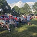 Many folks sat at the park in lawn chairs, listening to music and surrounded by vintage cars.