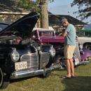 Many cars had their hoods up and windows down so people could get a closer look.