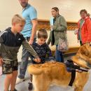 Students pet Norman. 