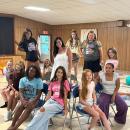 Gioioso and her students pose together. 