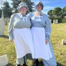 Jodie Camara, Mattapoisett assistant town clerk, and Cathy Heuberger, town clerk, dressed up as John Hammond’s two wives.