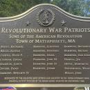 The plaque names 20 Revolutionary War soldiers from the Tri-Towns.