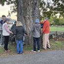 People gather around a 200-year-old red oak tree on Thursday, Oct. 22. Photo source: Sue Maxwell Lewis