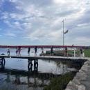 The team of eight boys, plus a coxswain, walks a boat to the waters of Sippican Harbor. Photo by Grace Roche