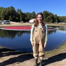 Editor Grace Roche dons waders before stepping into the bog. 