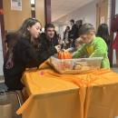 Kids play in a harvest-themed sensory bin. 