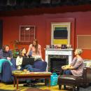 The three letter writers gather around Ruggiero's character as she shares advice. 