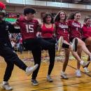 The junior class does a kickline during its class skit, modeled after the movie "The Odessey."