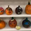 Decorate a pumpkin for a spooky contest.