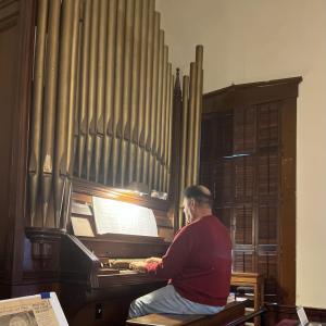 Gardzina playing the 127 year old organ. Photos by: Taylor Fruzzetti