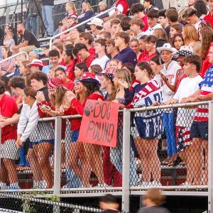 Bulldog fans show their support with signs and cheers. 