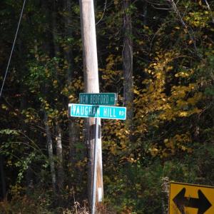 The boulder is located at the intersection of New Bedford Road and Vaughn Hill Road in Rochester. 