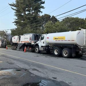 Construction vehicles at the intersection of Main Street and Spring Street.