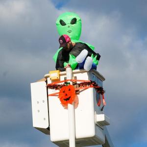The Department of Public Works sent candy from the top of their truck to trick-or-treaters below. The Department of Public Works sent candy from the top of their truck to trick-or-treaters below.