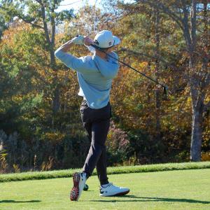 Brady Mills watches his ball go down the course.  Brady Mills watches his ball go down the course.