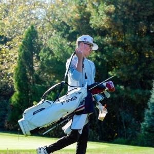 Brady Mills grabs his bag and moves down the course.  Brady Mills grabs his bag and moves down the course.