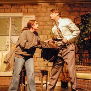 Jade Beauregard (Catherine) and Oliver Asker (Hal) fight over a bag.