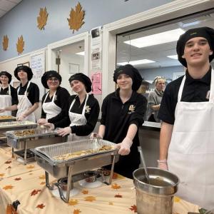 Old Colony students serve up delicious Thanksgiving fixings. 