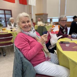 Another winner of a raffle is pleased to share her prize.