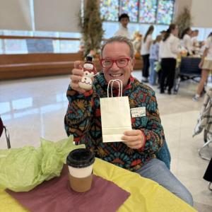 A resident is pleased with his snowman from the raffle.