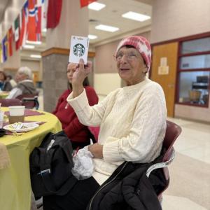 A winner is happy with her prize.
