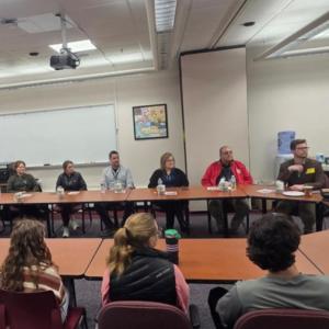 Mike Devoll leads a conversation between Old Rochester and Acushnet representatives.