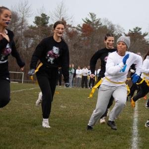 An Old Rochester player runs with the ball past Wareham’s defense during the annual Powderpuff football game on Tuesday, Nov. 21. Photos by Sawyer Smook-Pollitt