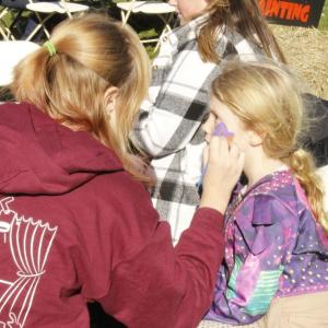 Norah Dawicki, 6, gets her face painted.